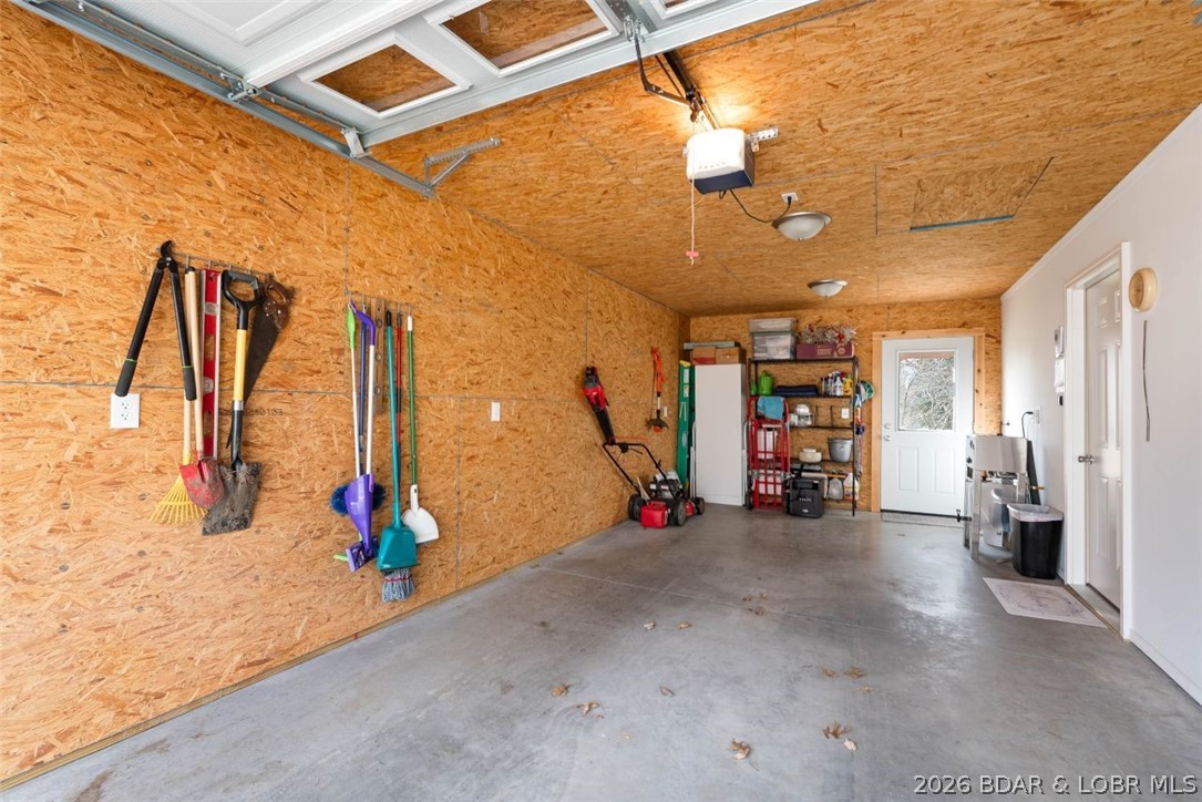 208 East Jemphrey Road Eldon, MO 65026 - Photo 30 of 45 Garage interior with room for vehicle and storage.