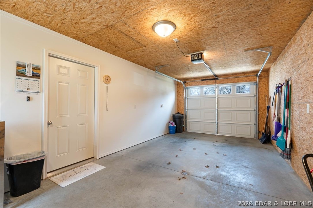 208 East Jemphrey Road Eldon, MO 65026 - Photo 31 of 45 tThe deep garage is 25' x 12' and features an ope