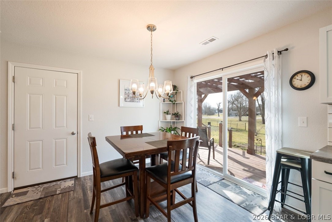 208 East Jemphrey Road Eldon, MO 65026 - Photo 9 of 45 Dining area sliding door provides access to the de