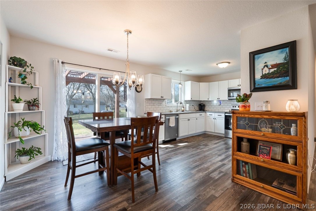 208 East Jemphrey Road Eldon, MO 65026 - Photo 10 of 45 Dining flows into the kitchen.