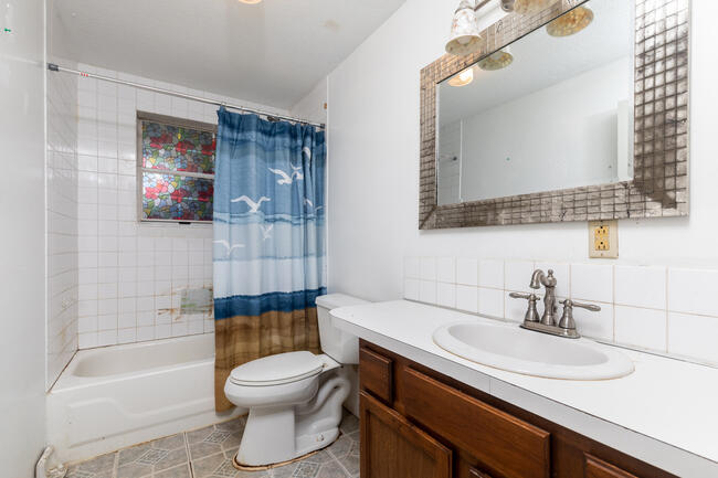 82 Deerfield Road Mashpee, MA 02649 - Photo 14 of 16 a bathroom with a sink a toilet and shower