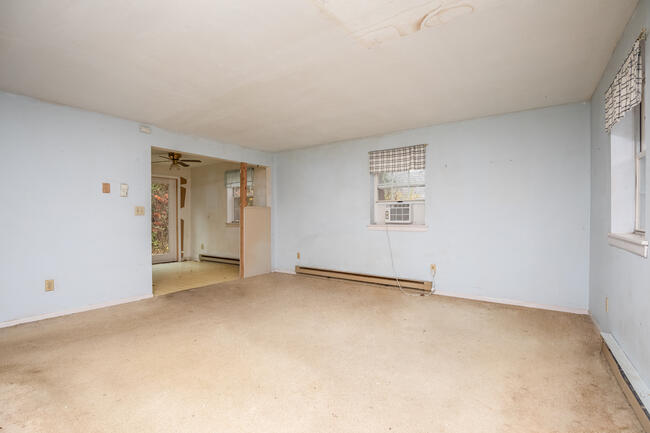 82 Deerfield Road Mashpee, MA 02649 - Photo 6 of 16 an empty room with windows