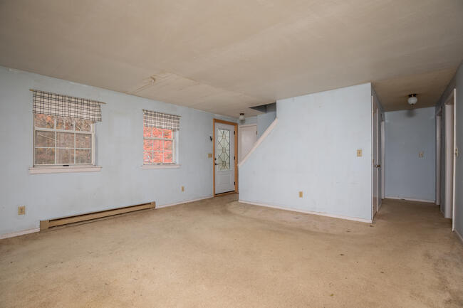 82 Deerfield Road Mashpee, MA 02649 - Photo 7 of 16 an empty room with windows