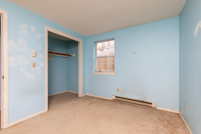 82 Deerfield Road Mashpee, MA 02649 - Photo 9 of 16 an empty room with windows