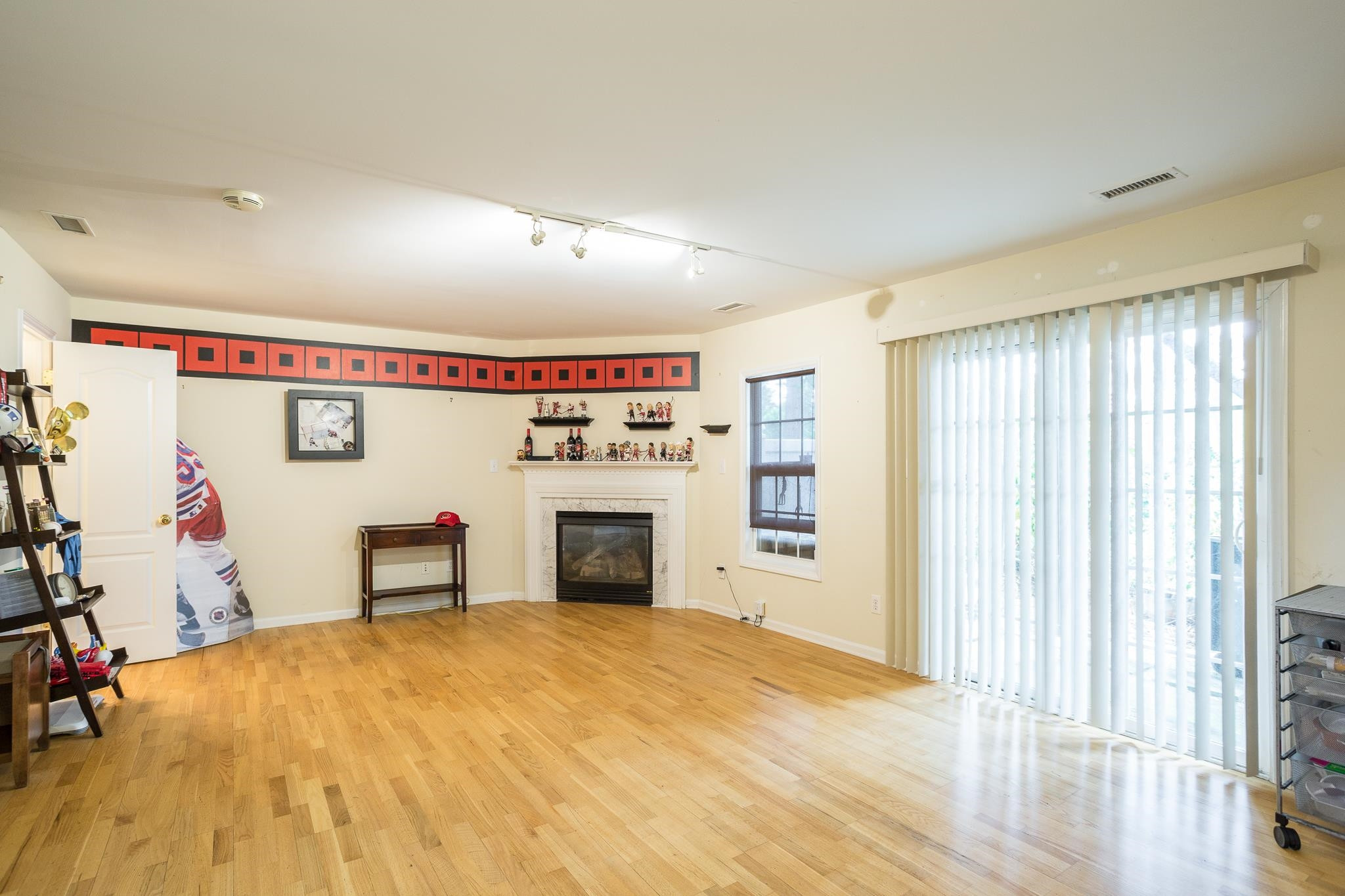 6905 Middleboro Drive Raleigh, NC 27612 - Photo 13 of 23 The fireplace in this flexible space is a great touch. You can also walk out to the back patio for some gardening. Bonus Room