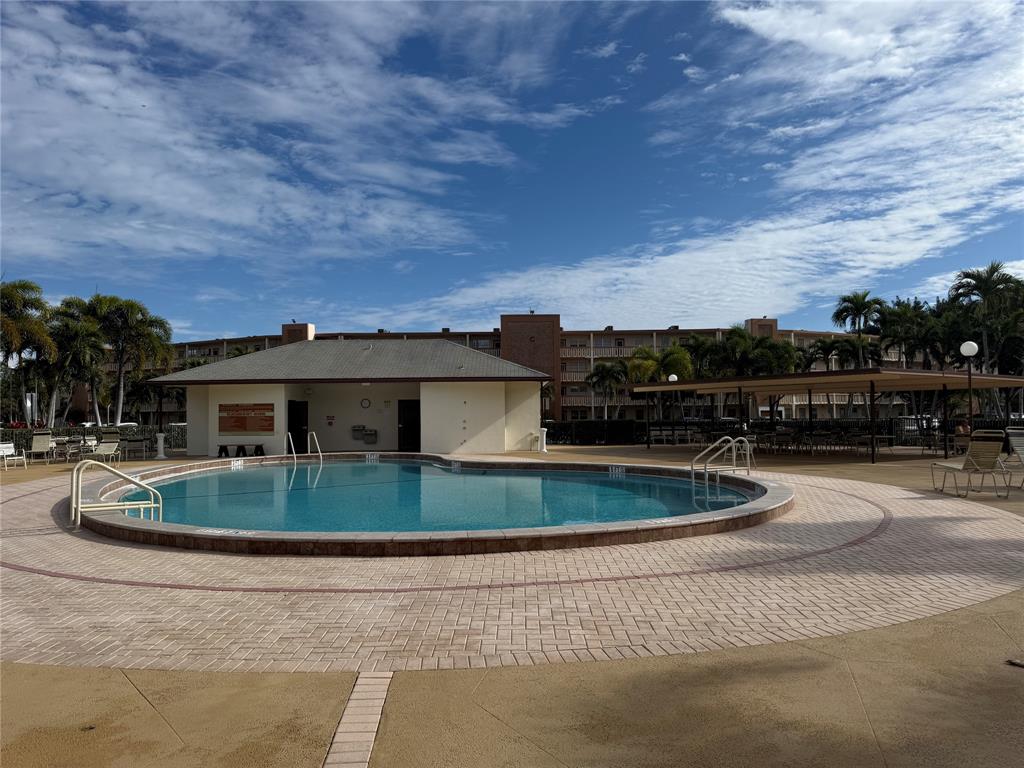 2017 Newcastle A, Unit 2017 Boca Raton, FL 33434 - Photo 40 of 41 a view of a houses with a yard