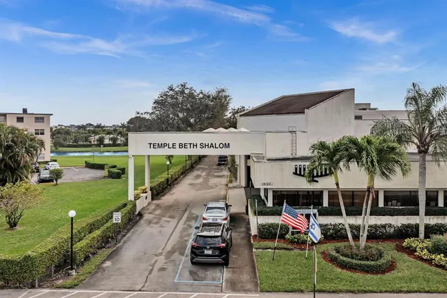 a front view of house with yard and outdoor seating
