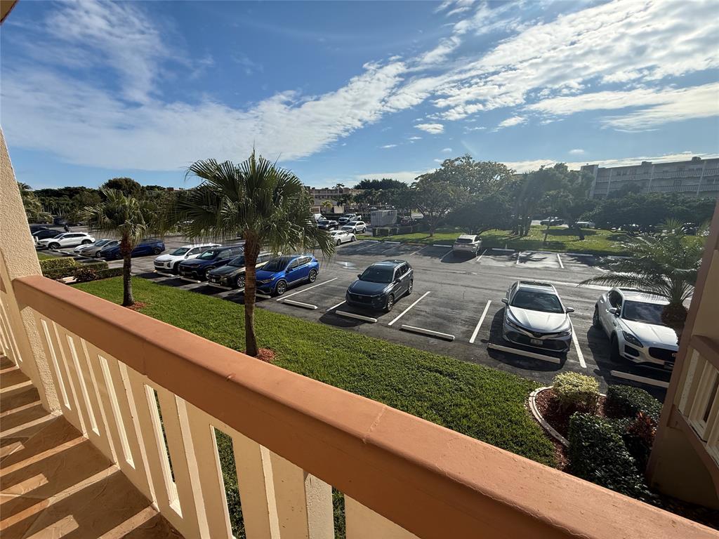 2017 Newcastle A, Unit 2017 Boca Raton, FL 33434 - Photo 8 of 41 a view of a garden with cars parked