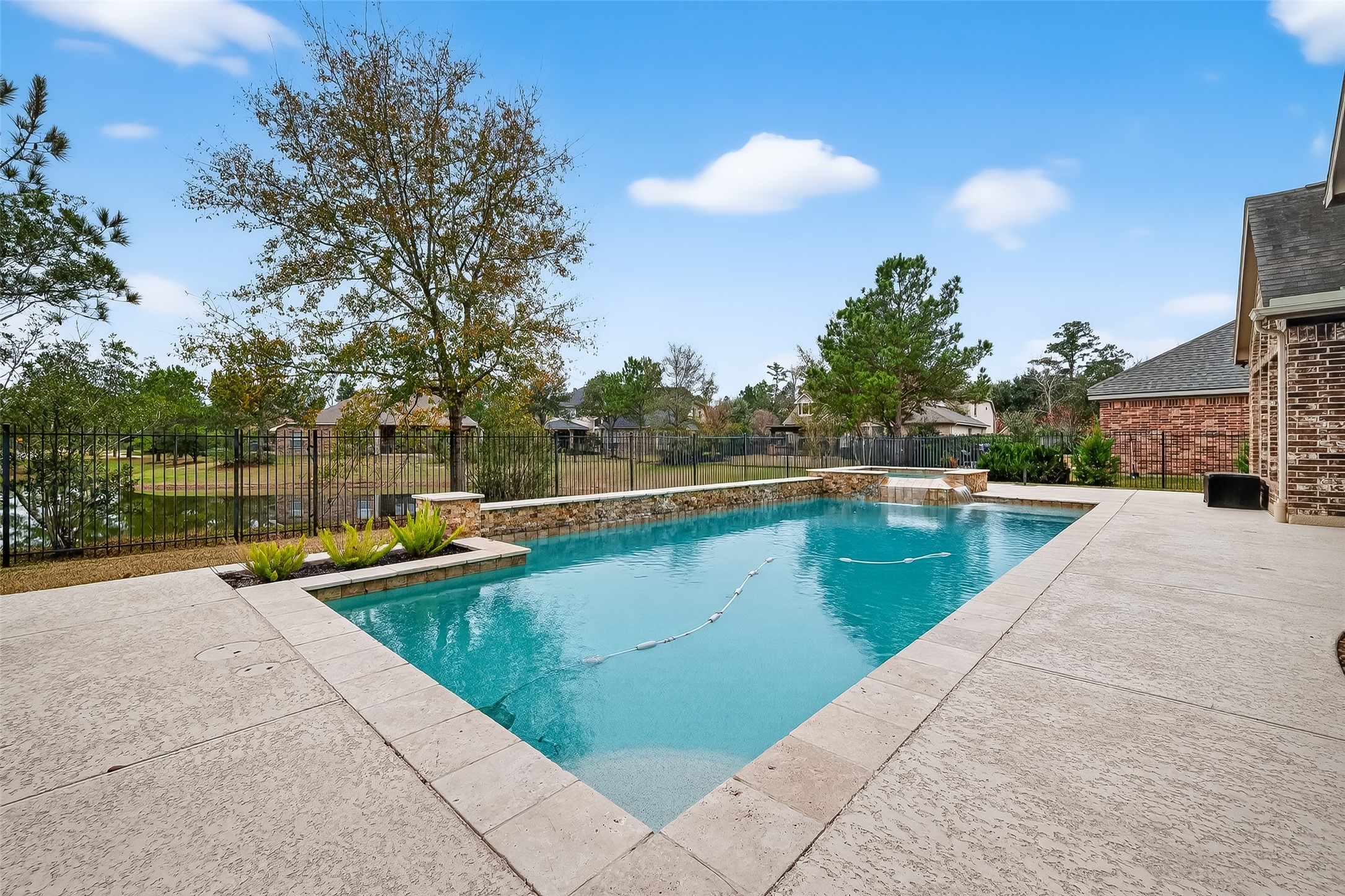 10 Cayuga Pond Court Spring, TX 77389 - Photo 1 of 50 a view of swimming pool with a back yard