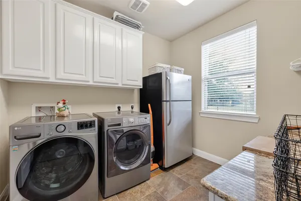 a large kitchen with stainless steel appliances lots of counter top space