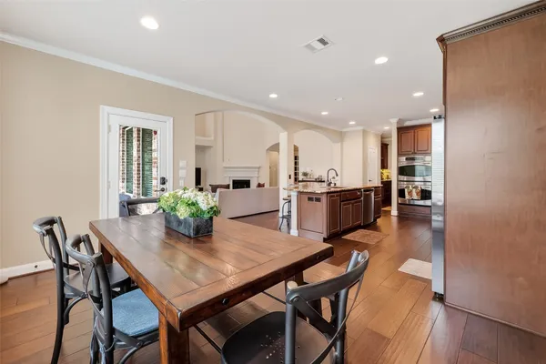 a living room with furniture wooden floor and a fireplace