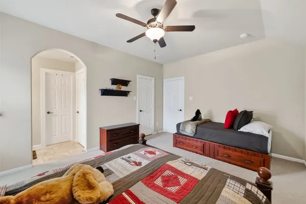 a bedroom with two beds and a window