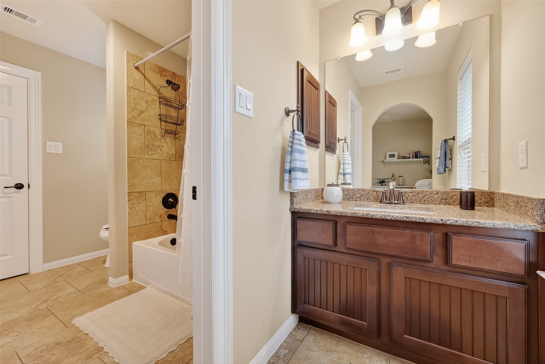 10 Cayuga Pond Court Spring, TX 77389 - Photo 30 of 50 a en suite bathroom with a sink mirror and a shower