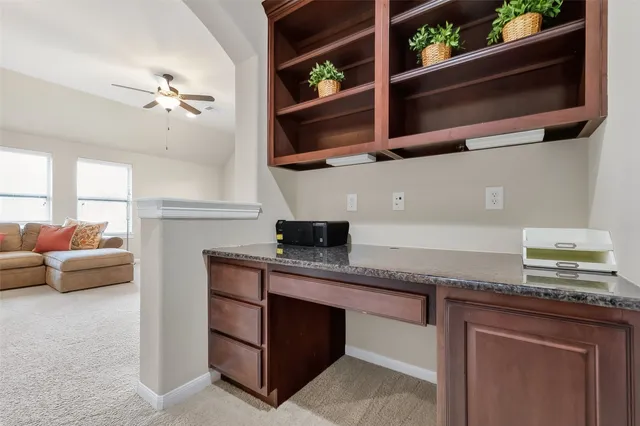 a kitchen with stainless steel appliances granite countertop a stove and a microwave
