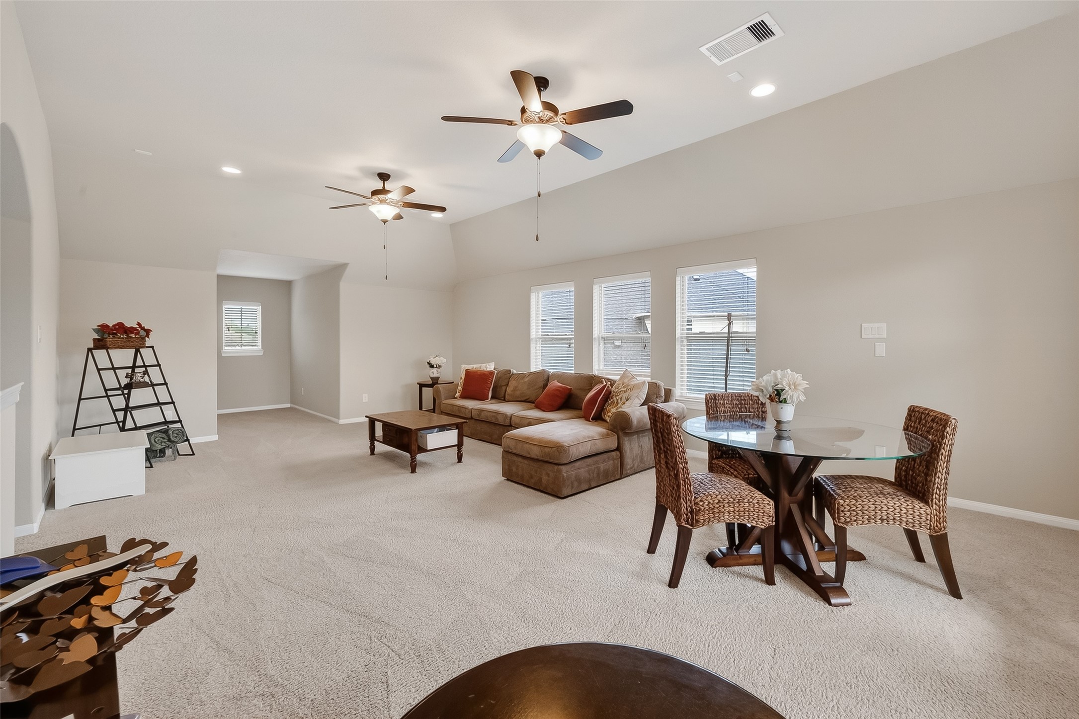 10 Cayuga Pond Court Spring, TX 77389 - Photo 38 of 50 a living room with furniture a chandelier and a window