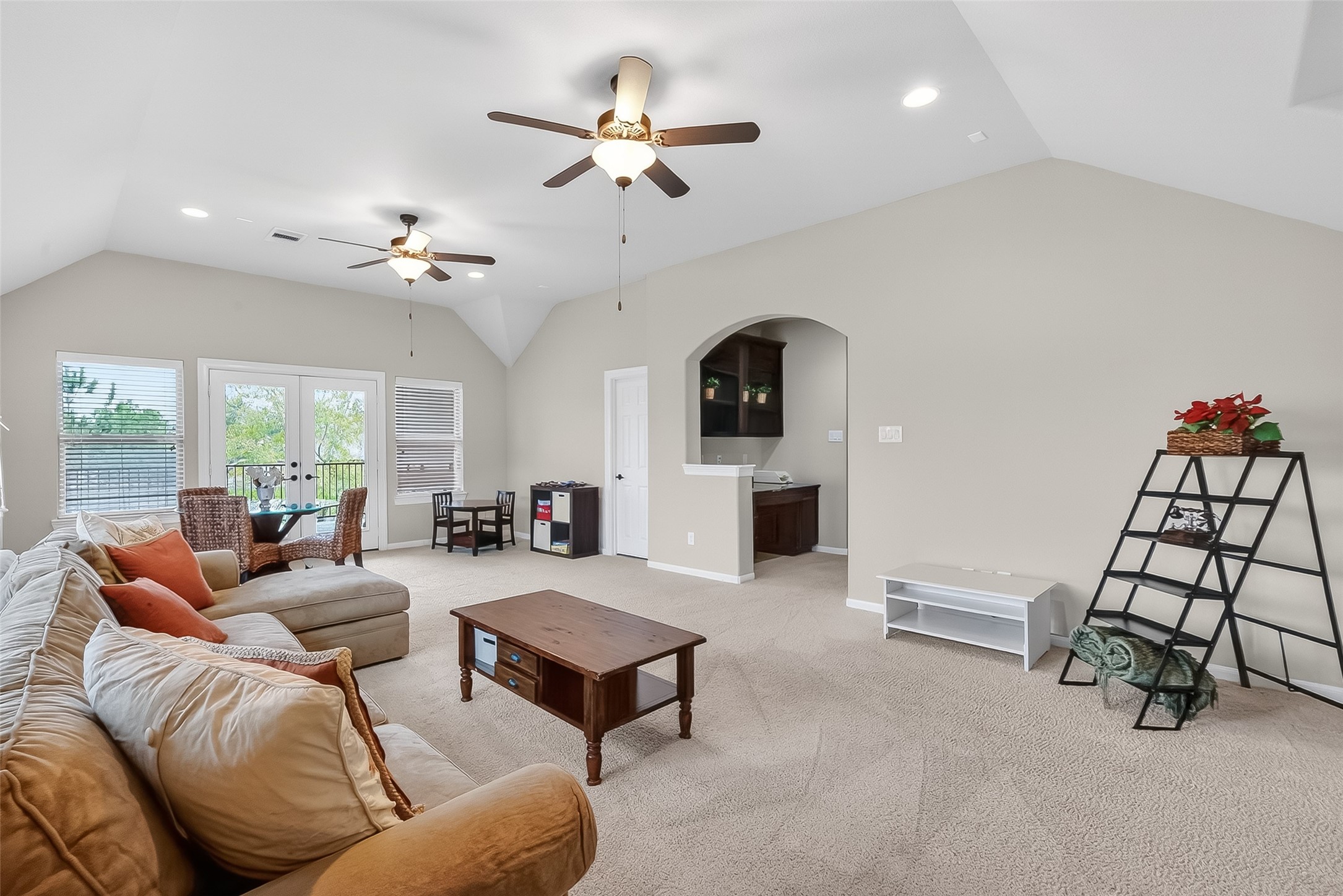 10 Cayuga Pond Court Spring, TX 77389 - Photo 43 of 50 a living room with furniture a rug and a chandelier