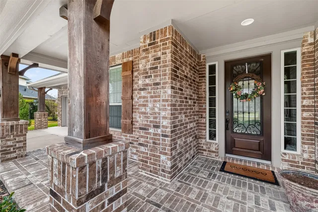 a front view of a house with a glass door