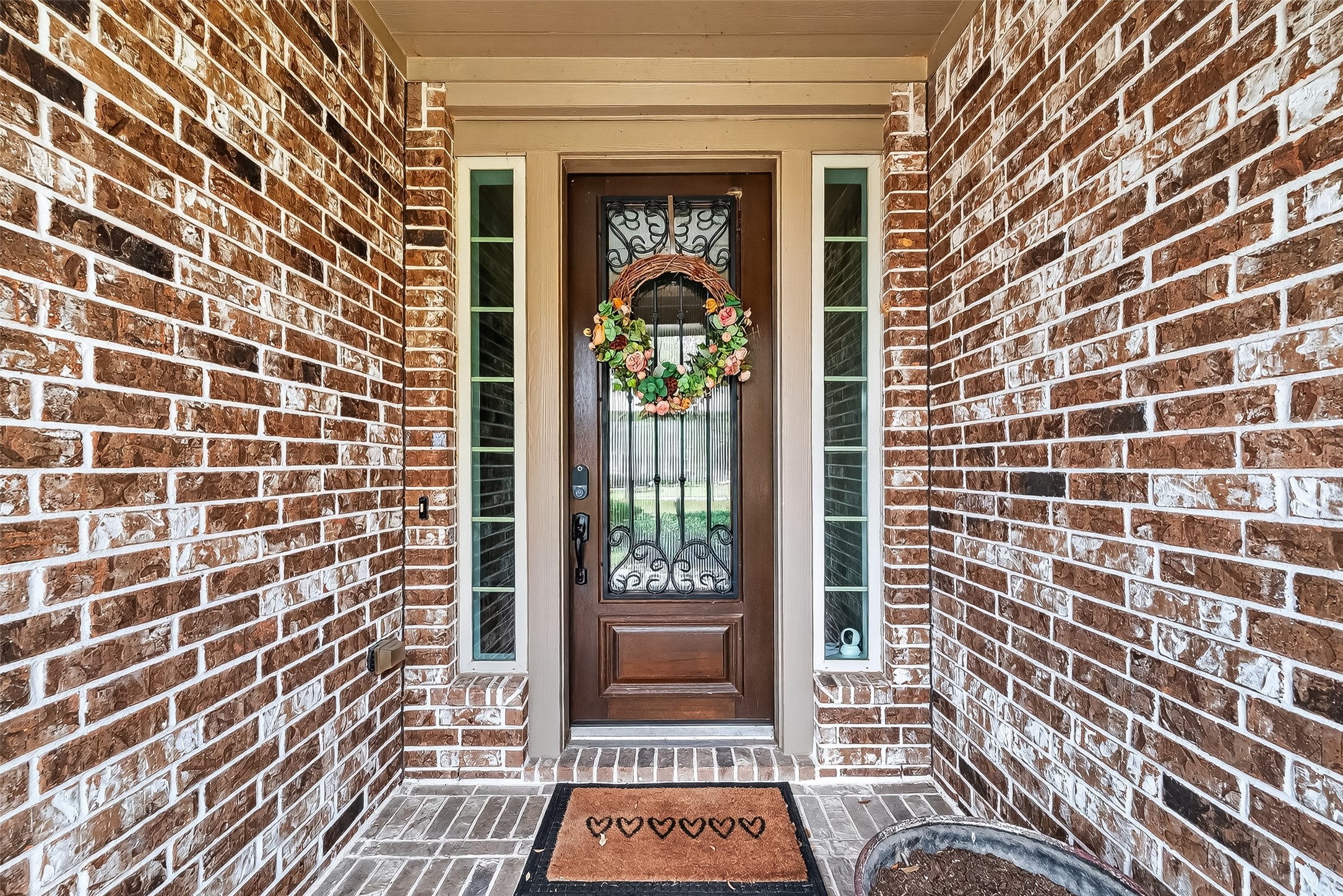 10 Cayuga Pond Court Spring, TX 77389 - Photo 6 of 50 a view of a brick wall with windows