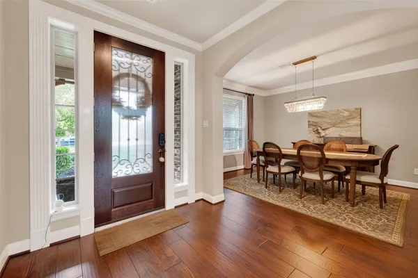 a view of a livingroom with furniture and hardwood floor