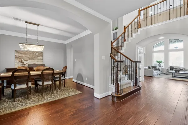 a kitchen with kitchen island granite countertop a sink cabinets and stainless steel appliances