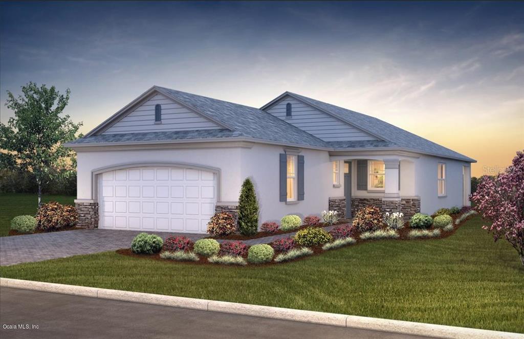 7711 Southwest 88th St Road Ocala, FL 34476 - Photo 1 of 1 a front view of a house with a garden and plants