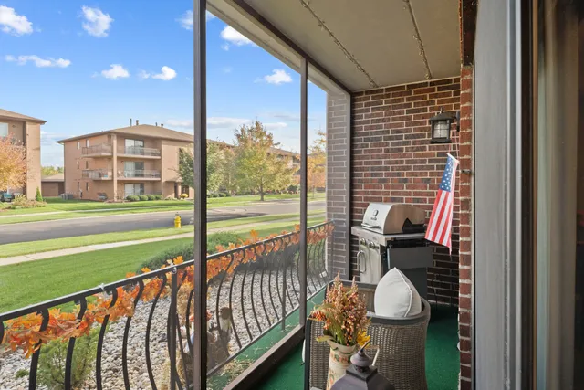 a view of balcony with wooden floor