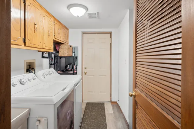 a kitchen with a sink a stove and cabinets