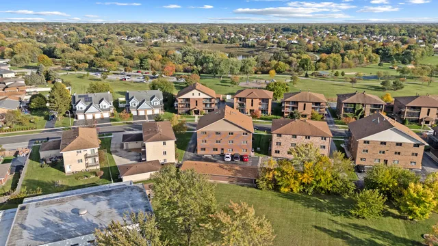 an aerial view of a house with a lake view