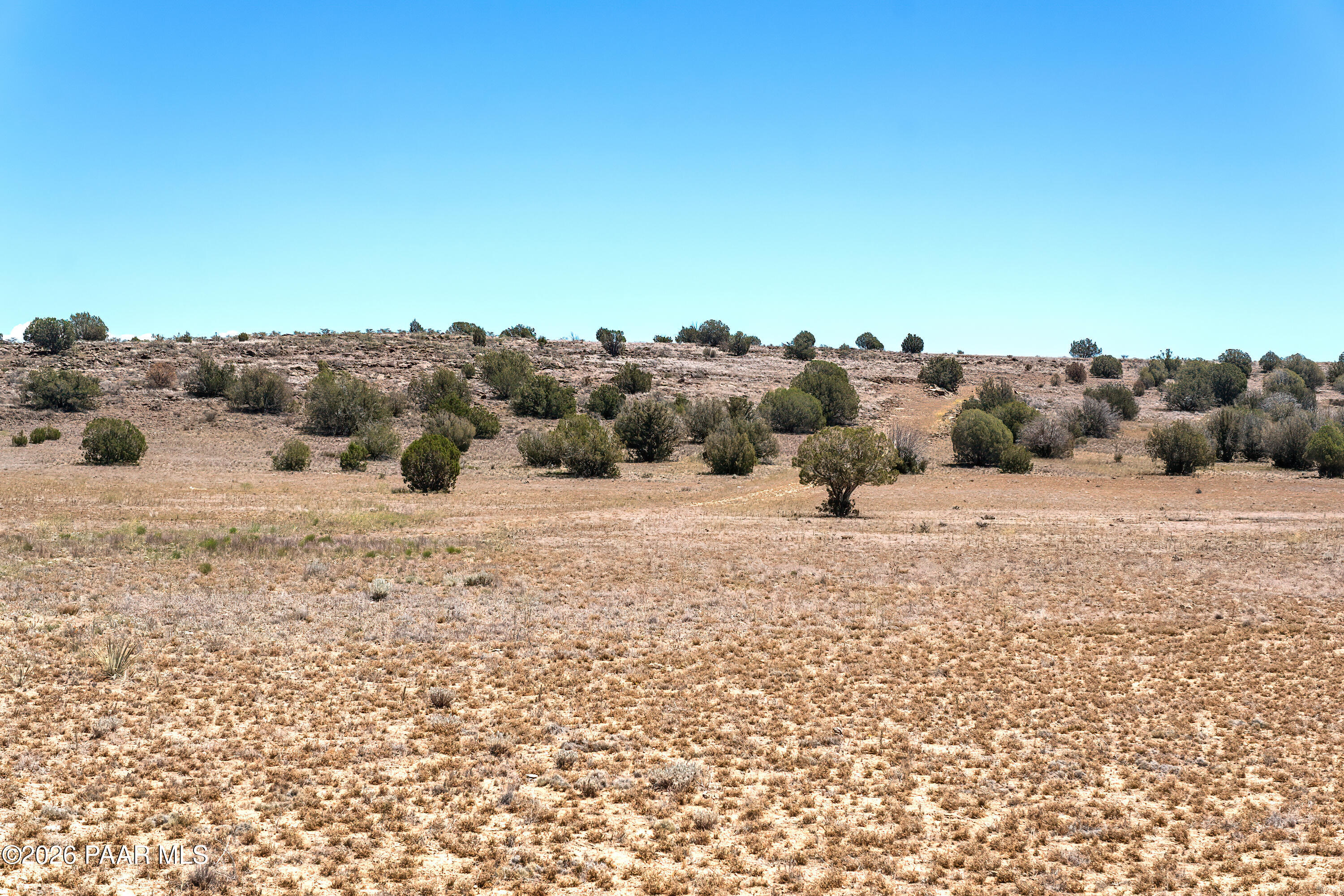 0 North Headwaters Road Paulden, AZ 86334 - Photo 12 of 27 a view of a dry yard with wooden fence
