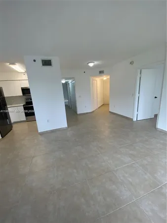 a close view of a sink a faucet and appliance in the kitchen
