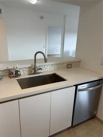 a kitchen with stainless steel appliances a refrigerator a stove and a microwave