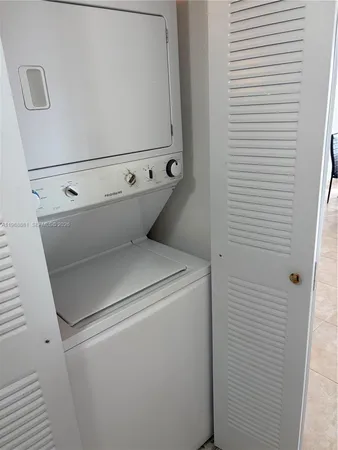 a view of a dining room with furniture and a window