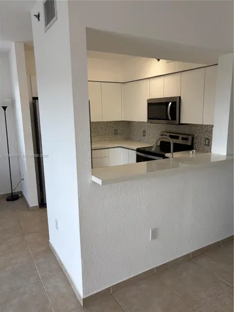 a view of terrace with seating space and hardwood floor