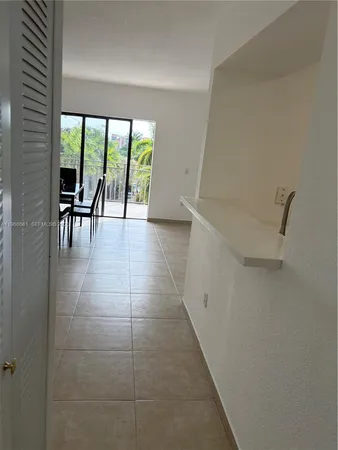 a view of a balcony with wooden floor