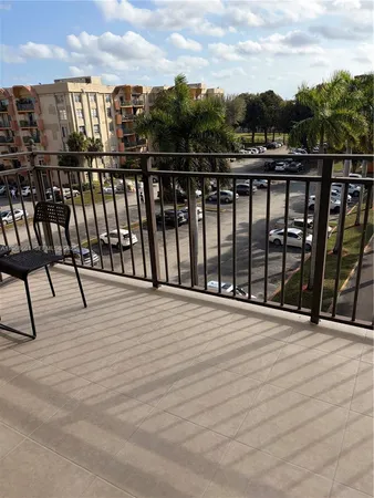 a view of a swimming pool with seating area and furniture