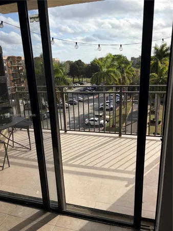 a view of a swimming pool with a yard