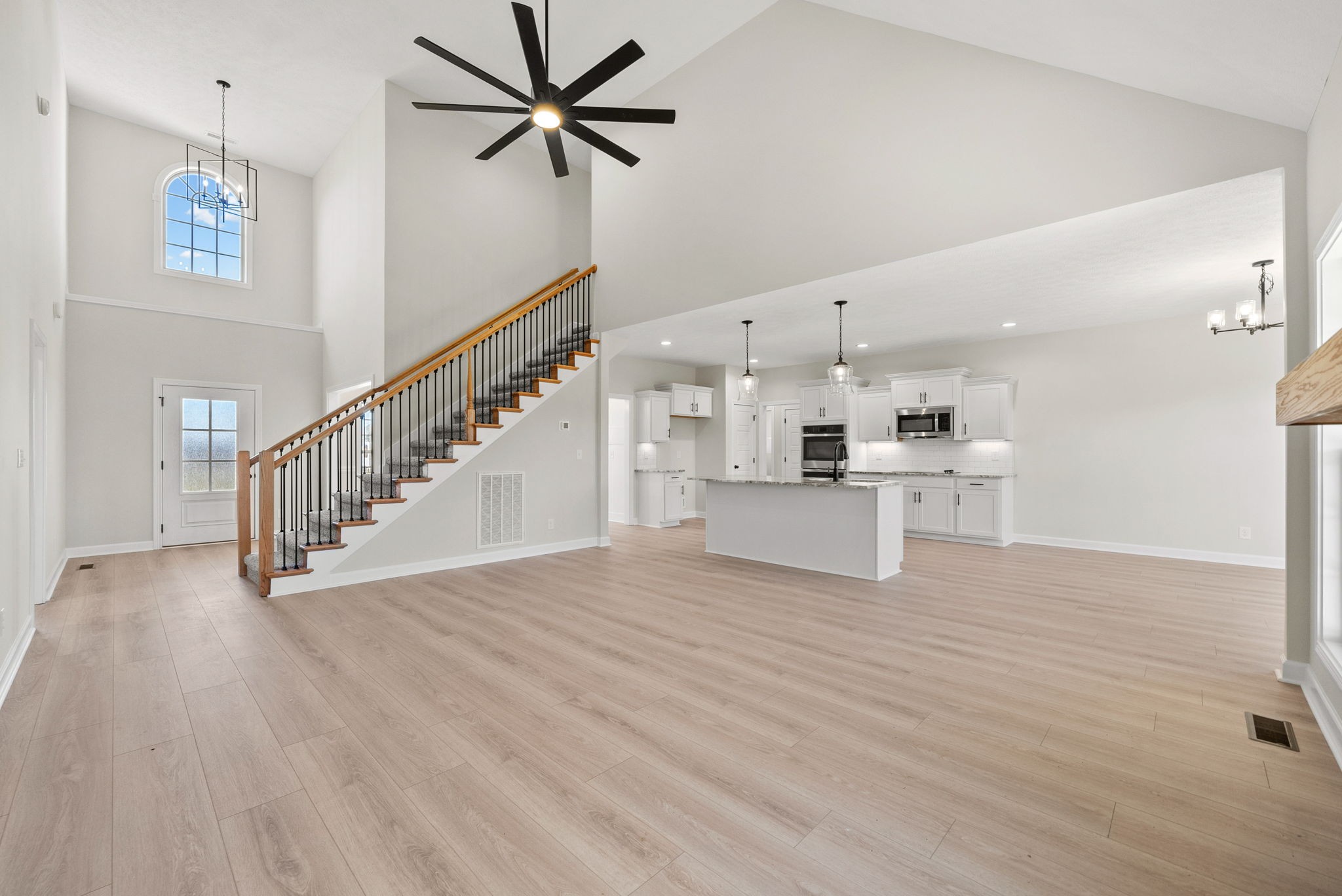 571 Fieldview Way Clarksville, TN 37043 - Photo 11 of 48 a view of an empty room with wooden floor and a ceiling fan