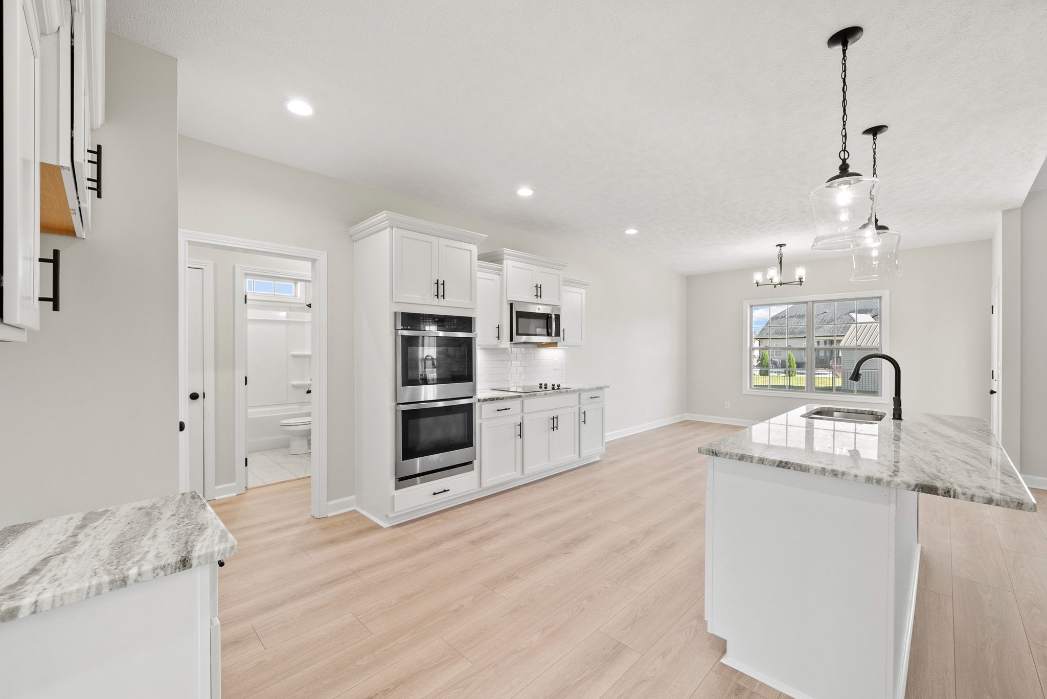 571 Fieldview Way Clarksville, TN 37043 - Photo 14 of 48 a large kitchen with kitchen island a sink stainless steel appliances and cabinets