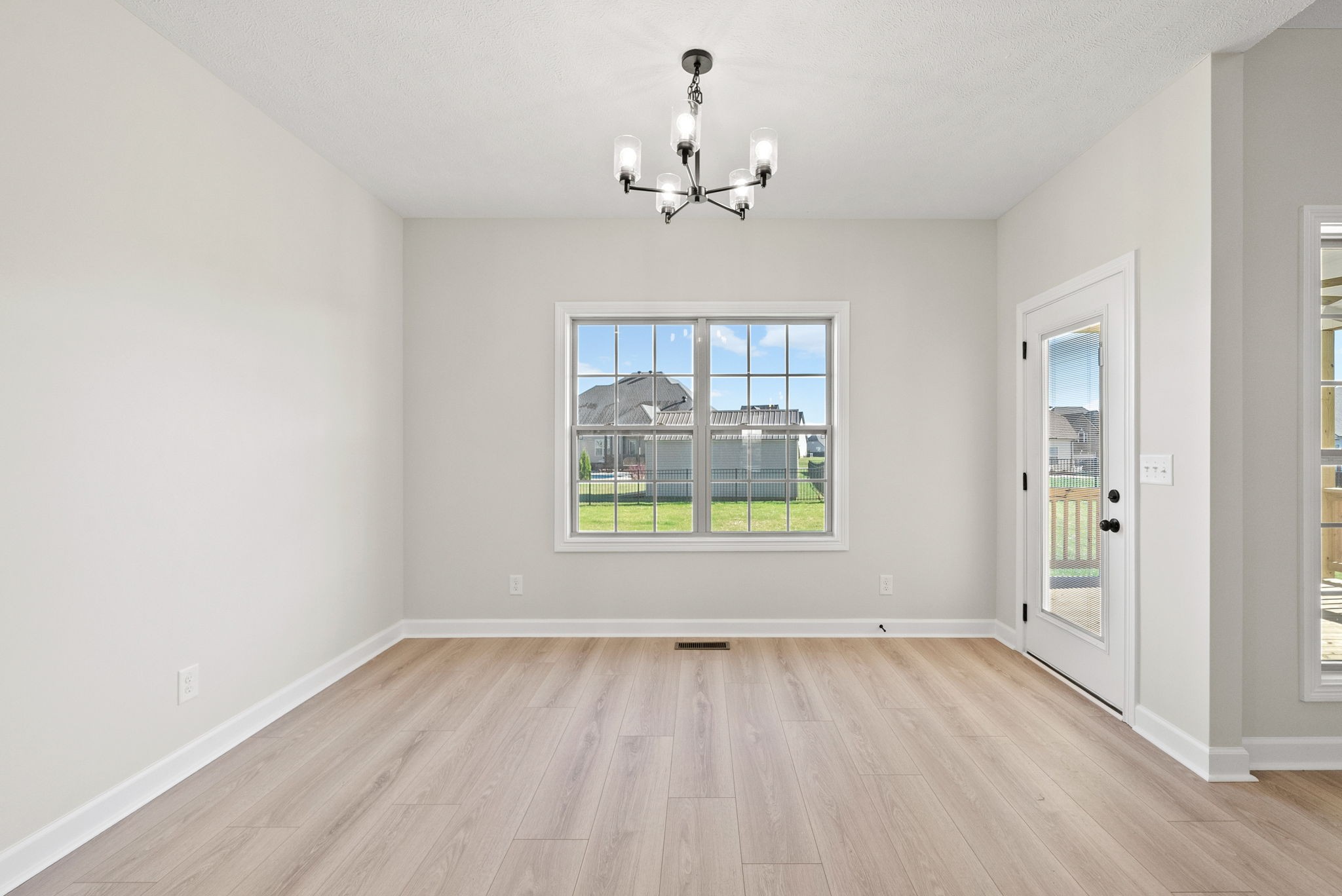 571 Fieldview Way Clarksville, TN 37043 - Photo 15 of 48 wooden floor in an empty room with a window