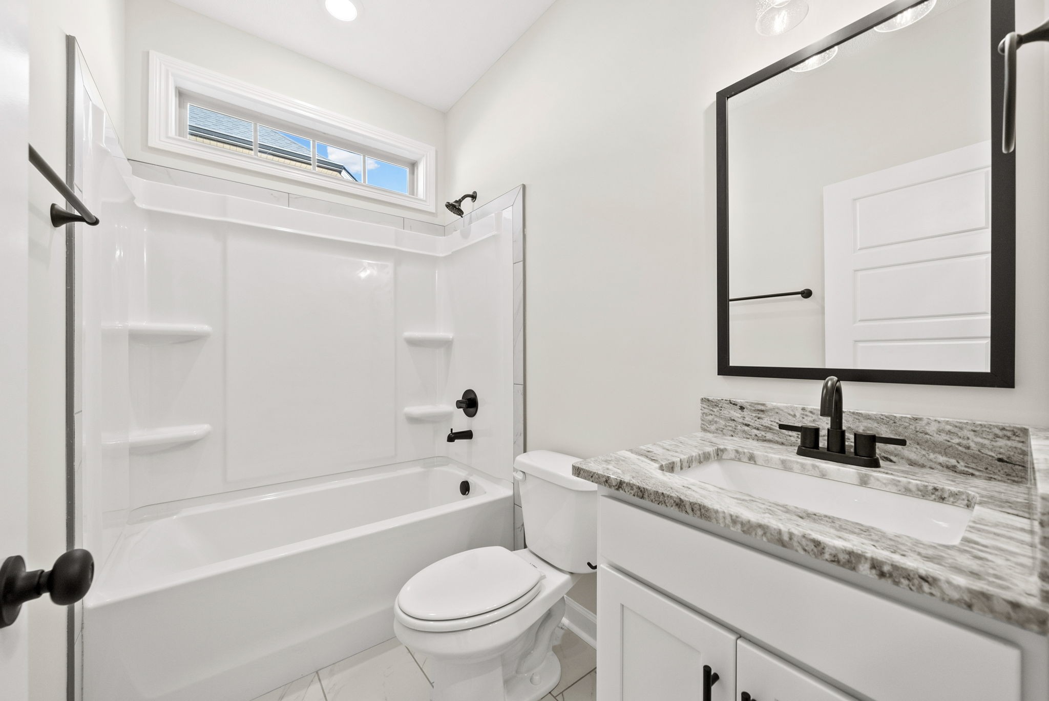 571 Fieldview Way Clarksville, TN 37043 - Photo 22 of 48 a bathroom with a granite countertop sink toilet mirror and bathtub