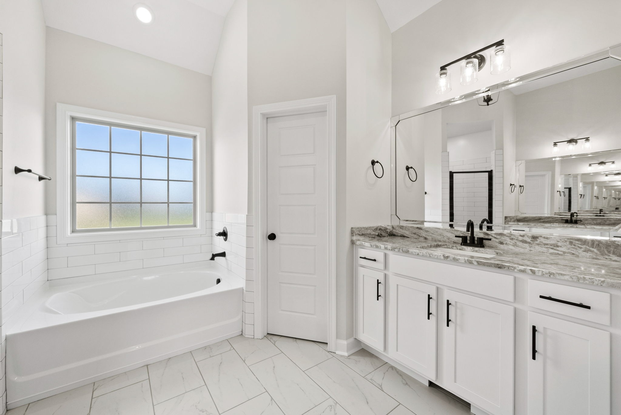 571 Fieldview Way Clarksville, TN 37043 - Photo 27 of 48 a bathroom with a granite countertop sink a mirror and a bathtub
