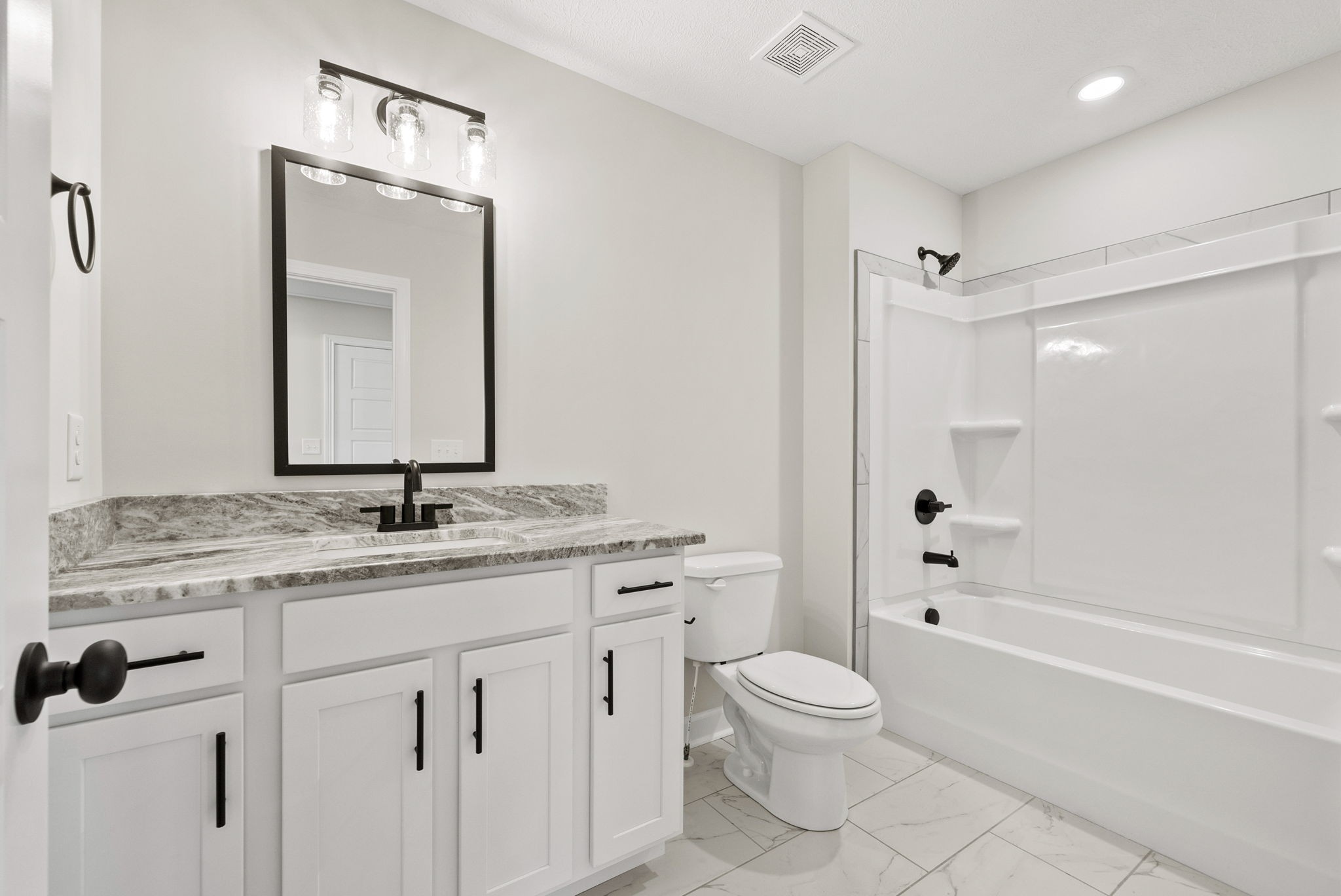 571 Fieldview Way Clarksville, TN 37043 - Photo 38 of 48 a bathroom with a granite countertop toilet a sink and a bathtub
