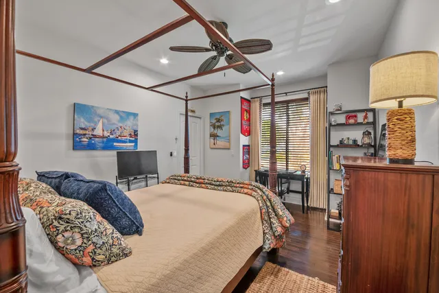 a bedroom with furniture and a wooden floor