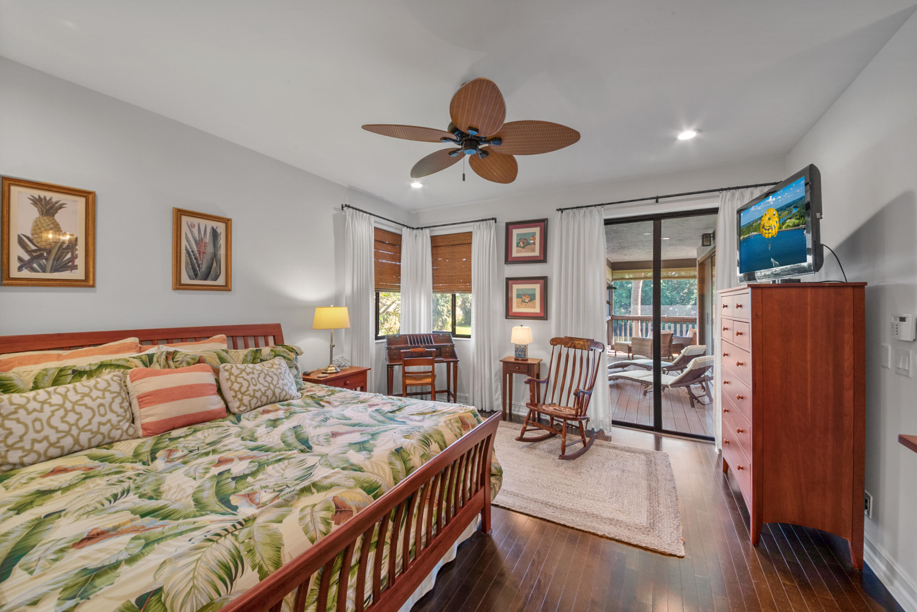 19199 Sabal Lake Drive Boca Raton, FL 33434 - Photo 16 of 40 a bedroom with furniture and a wooden floor