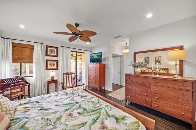 a balcony with wooden floor and outdoor seating
