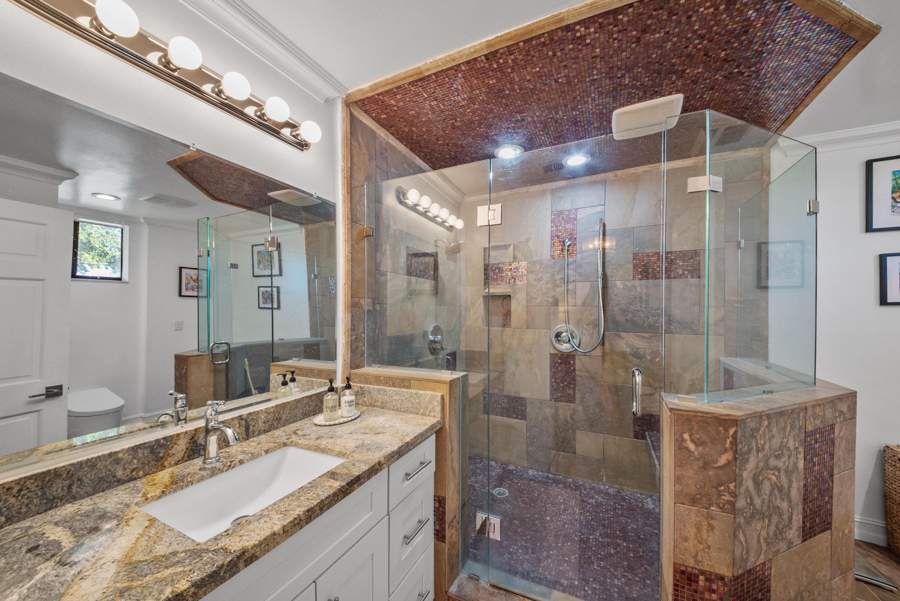 19199 Sabal Lake Drive Boca Raton, FL 33434 - Photo 19 of 40 a bathroom with a granite countertop sink a shower and a mirror