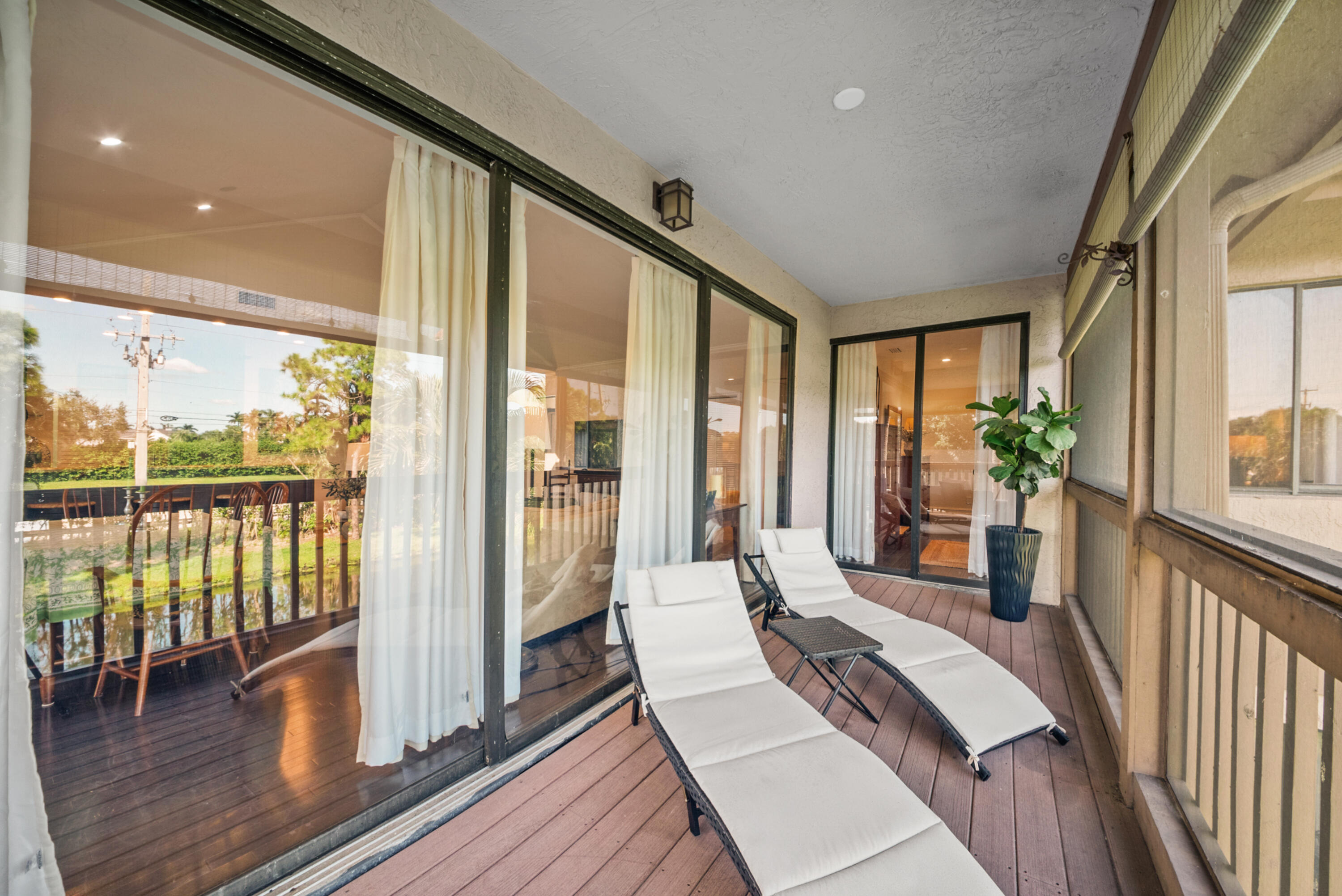 19199 Sabal Lake Drive Boca Raton, FL 33434 - Photo 22 of 40 a spacious bedroom with a large window and wooden floor
