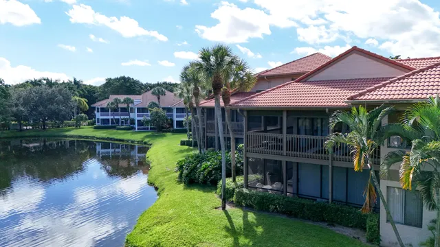 an aerial view of residential houses with outdoor space and river