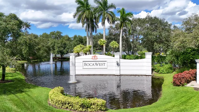 a view of multiple house with outdoor space and swimming pool