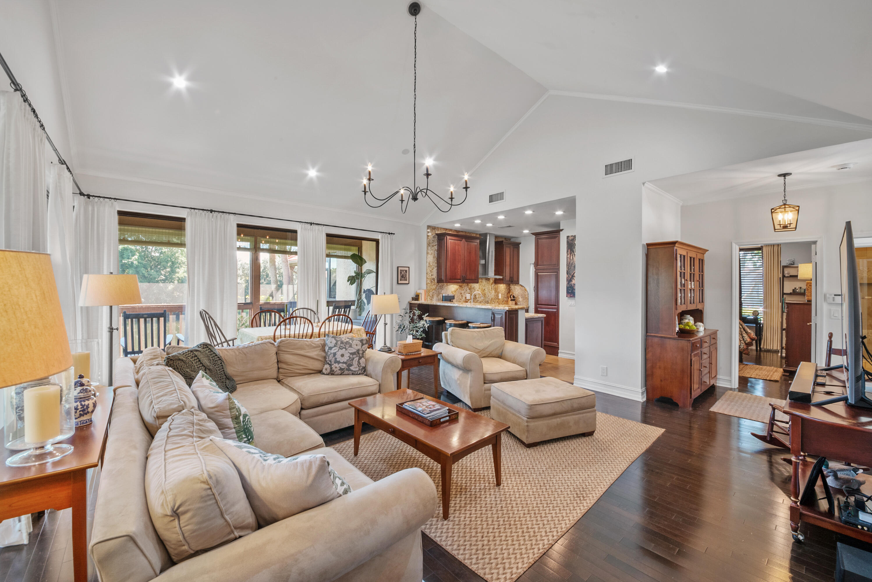 19199 Sabal Lake Drive Boca Raton, FL 33434 - Photo 4 of 40 a living room with furniture kitchen view and a large window